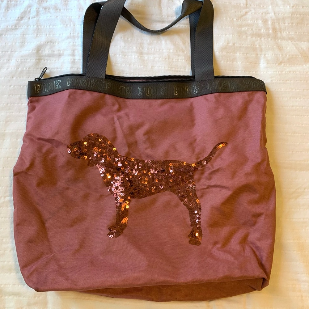 Victoria’s Secret pink travel bag. Small stain on back. $5